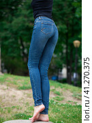 Back view of a long women legs posing with jeans. Стоковое фото, фотограф Андрей Аркуша / Фотобанк Лори