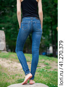 Back view of a long women legs posing with jeans. Стоковое фото, фотограф Андрей Аркуша / Фотобанк Лори