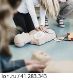 First aid resuscitation course using AED. Стоковое фото, фотограф Matej Kastelic / Фотобанк Лори