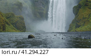 Beautiful Skogafoss waterfall with river reflection in Iceland. Стоковое фото, фотограф Igor Tichonow / Фотобанк Лори