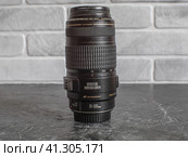 Zoom lens with a focal length of 70-300mm F4-5.6 for the EF mount. Стоковое фото, фотограф Воловодов Владимир / Фотобанк Лори