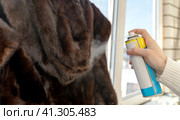Treatment of fur with a means against moths. Стоковое фото, фотограф Igor Skripachev / Фотобанк Лори