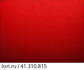 The background is red or scarlet. A beautiful festive heterogeneous textured background with specks, dots, veins, fibers, relief and other textures. Gradient change in color and awareness. Copy space. Стоковое AI-изображение, AI-художник Юлия Петровская / Фотобанк Лори