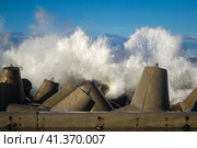 Concrete breakwater at the coast of the sea. Стоковое фото, фотограф Долотова Елена Викторовна / Фотобанк Лори