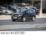 Haval M6 car driving on city road with motion blur, front side view. Редакционное фото, фотограф Константин Григорьев / Фотобанк Лори