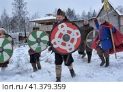The festival is a historical reconstruction of the Viking Age in winter. Vikings attack with shields and helmets (2014 год). Редакционное фото, фотограф Анна Кривицкая / Фотобанк Лори