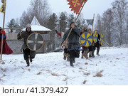 The festival is a historical reconstruction of the Viking Age in winter. Vikings attack with shields and helmets (2014 год). Редакционное фото, фотограф Анна Кривицкая / Фотобанк Лори