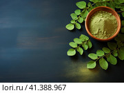 Fresh moringa leaves and powder on dark blue background with copy space. AI generated. Стоковое AI-изображение, AI-художник Александра Селина / Фотобанк Лори