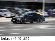 Matte black Mercedes GT 63 S AMG V8 BiTurbo in motion. Mercedes AMG at high speed with blurred urban background. Редакционное фото, фотограф Константин Григорьев / Фотобанк Лори