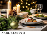 Christmas dining table, Christmas decor with a Christmas tree in the background, Стоковое AI-изображение, AI-художник Ирина Ручушкина / Фотобанк Лори