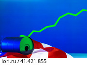 Price of american oil is changing concept. Black barrel with oil and graph. Стоковое фото, фотограф Сергей Толмачёв / Фотобанк Лори
