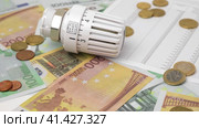 Thermostatic Valve Head is Spinning on Euro Banknotes Background. Increase in the Cost of Electricity and Heating Concept. Price Hike. Gas Crisis. Utility Bill Saving, Energy Cost and Conservation. Стоковое видео, видеограф Марина Демидюк / Фотобанк Лори