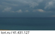Deep sea. Dramatic thunderclouds over the horizon. Black Sea waves before a hurricane. Storm warning is a forecast of the occurrence of dangerous natural meteorological phenomena. Waves with foam cap. Стоковое видео, видеограф Юлия Петровская / Фотобанк Лори