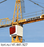 Moscow, Russia - Oct 11.2023. Cabin and part of the liebherr crane boom. Редакционное фото, фотограф Володина Ольга / Фотобанк Лори