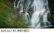 Woman hiking to Gollinger waterfall in the forest in Austria. Traveling in the mountains, adventure. Стоковое фото, фотограф Ольга Сухарева / Фотобанк Лори