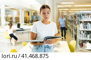 View on a young Caucasian student holding books. Стоковое фото, фотограф Яков Филимонов / Фотобанк Лори