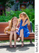Two young beautiful women secret at summer green park. Стоковое фото, фотограф Андрей Аркуша / Фотобанк Лори