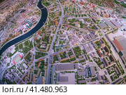 Moscow, Russia - November 16, 2019: The architectural Moscow Grand maket, layout of buldings and roads. Bird's eye view. Fish eye lens. Редакционное фото, фотограф YuryKara / Фотобанк Лори