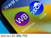 Adygea, Russia - August 13, 2023: icons of popular mobile applications marketplace Wildberries, Ozon on the screen of an android smartphone xiaomi close-up. Редакционное фото, фотограф Андрей С / Фотобанк Лори