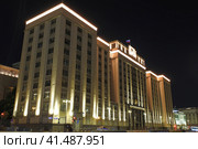 Moscow - August 7, 2023. Building of Russian parliament Gosudarstvennaya Duma in Okhotny Ryad street. Summer night view. Редакционное фото, фотограф Александр Кузнецов / Фотобанк Лори