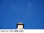 Chimney against the blue sky. Стоковое фото, фотограф Andrew_Swarga / Фотобанк Лори