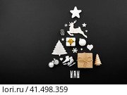 Christmas tree made of decorations on black background. Стоковое фото, фотограф Евдокимов Максим / Фотобанк Лори