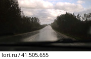 Extreme Driving during heavy downpour storm. Selective focus. POV of car windscreen. Dangerous wet asphalt road trip. Bad visibility. Moving windshield wiper vehicle. Traffic at Rainfall. Travel blog. Стоковое видео, видеограф Марина Демидюк / Фотобанк Лори