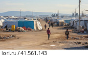 A group of children live in a refugee camp. Стоковое AI-изображение, AI-художник Кирилл Черезов / Фотобанк Лори
