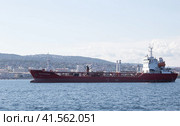 A merchant ship in the bay of the city of Novorossiysk on a raid in the summer Translated by Tigran Martirosyan (2021 год). Редакционное фото, фотограф Алексей Корсуков / Фотобанк Лори