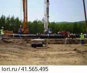 Construction of gas pipeline on the ground. Стоковое фото, фотограф Леонид Еремейчук / Фотобанк Лори