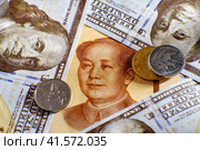 Chinese yuan money and US dollars, close-up. Dollar bills and yuan from China. Стоковое фото, фотограф Андрей Журавлев / Фотобанк Лори