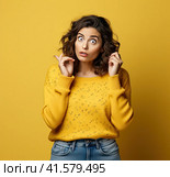 A young smiling confident pretty attractive European girl of 20 years old in a gray casual T-shirt, looking away, isolated on a white background Created by AI. Стоковое AI-изображение, AI-художник Ярославский Максим / Фотобанк Лори