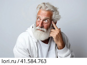 Portrait of an elderly man with a large gray beard and lush hair on his head with a thoughtful look. White background. Generated by AI. Стоковое AI-изображение, AI-художник Ярославский Максим / Фотобанк Лори