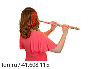 Woman musician with a flute on a studio isolated white background. Flutist with a large concert transverse flute, close up. Стоковое фото, фотограф Андрей Журавлев / Фотобанк Лори