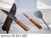 Cutlery - a spoon, a two-pronged fork and a knife. Reconstruction of objects of medieval European life of the 13th century. Стоковое фото, фотограф Андрей Журавлев / Фотобанк Лори