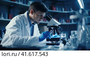 Microbiologist scientist looking through a microscope. Стоковое AI-изображение, AI-художник Кирилл Черезов / Фотобанк Лори
