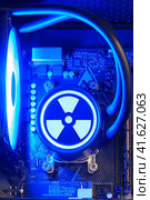 Liquid cooling system inside the computer system unit, gaming PC and the radiation sign. Стоковое фото, фотограф Андрей Журавлев / Фотобанк Лори