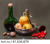 still life with a female Yemeni chameleon sitting on a green apples next to green bottle and melchior glass. Стоковое фото, фотограф Артем Курутин / Фотобанк Лори