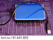 External portable hard drive with usb cable. Стоковое фото, фотограф Андрей Журавлев / Фотобанк Лори
