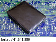 External portable hard drive in blue background. Стоковое фото, фотограф Андрей Журавлев / Фотобанк Лори