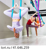 Different inversion aerial yoga with hammock. Стоковое фото, фотограф Яков Филимонов / Фотобанк Лори