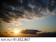 Altocumulus, cirrus and cumulus clouds on the sky at sunset, background, copy space for text. Стоковое фото, фотограф Андрей Журавлев / Фотобанк Лори