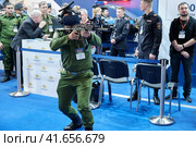 Training soldiers virtual reality helmet at exhibition Interpolitex - Moscow, Russia, 10 25 2019. Редакционное фото, фотограф Андрей Журавлев / Фотобанк Лори