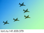 Moscow / Russia - 05 09 2014: aircraft group flying in the blue sky, close-up. Редакционное фото, фотограф Андрей Журавлев / Фотобанк Лори