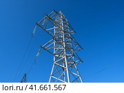 Supports high-voltage power lines against the blue sky. Стоковое фото, фотограф Леонид Еремейчук / Фотобанк Лори