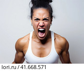 A woman in a state of extreme rage, with clenched fists and jaw, angry, emotional and furious. Generated by AI. Стоковое AI-изображение, AI-художник Ярославский Максим / Фотобанк Лори