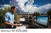 A meteorologist analyzes weather information. Стоковое AI-изображение, AI-художник Кирилл Черезов / Фотобанк Лори