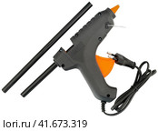 Клеевой пистолет на белом фоне. Electric hot glue gun isolated on white background. Стоковое фото, фотограф Татьяна Д / Фотобанк Лори