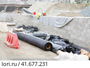 rolls mesh road, rolls of geogrid for reinforcement the roadbed, rolls construction basalt wire mesh of asphalt and concrete road surfaces. Стоковое фото, фотограф Ольга Яковенко / Фотобанк Лори