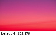 The gradient of the sky during sunset was breathtaking. The clear sky turned into a beautiful gradient of oranges and pinks during sundown. Стоковое видео, видеограф Андрей Журавлев / Фотобанк Лори